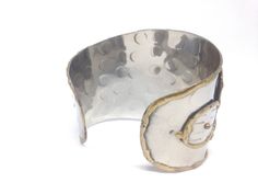 "Vintage Estate Blue Silver/Gold Tone Ethnic Cuff Bracelet This lovely piece can be worn on any occasion and is absolutely beautiful in the light, both inside and out, the perfect gift for anyone who loves vintage jewelry. - Measures Approx. 7 3/4\" long - Each order comes shipped in a small drawstring pouch, all ready for gifting. -If you are wanting to have this mailed as a gift to a special someone, please write their address in the note section, otherwise it will be mailed to you. -If you wo Adjustable Artisan Metal Bangle, Artisan Metal Cuff Bangle Bracelet, Handmade Artisan Metal Cuff Bracelet, Bohemian Stamped Cuff Jewelry, Handmade Artisan Metal Bangle, Handmade Metal Artisan Bangle, Artisan Nickel-free Cuff Bracelet Bangle, Adjustable Artisan Bangle Cuff Bracelet, Artisan Bangle Cuff Bracelet For Festivals