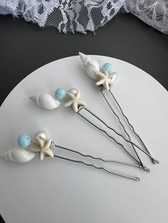 Silver hair pin made with a white seashell, freshwater pearls and white starfish and a light turquoise crystal bead. Pin measures approximately 3.5 inches high.   Set of 3 Seashell Hair Pins, Ocean Themed Accessories, Beach Hair Wedding, Starfish Hair Clip, Ocean Hair, Wedding Hair Pin, Rustic Beach Wedding, Silver Hair Pin, Wedding Hair Piece