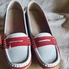 Comfort Life Leather Red And White Loafers. They Are Supposed To Be A Sz 10 But I Believe They Are A 9.5. Leather Upper, Cushioned Support Insole, Rubber Bottom. White Round Toe Boat Shoes With Rubber Sole, White Boat Shoes With Rubber Sole And Round Toe, White Boat Shoes With Rubber Sole, Red Closed Toe Slip-ons For Spring, Red Round Toe Slip-ons For Spring, Red Closed Toe Casual Loafers, Red Low-top Loafers For Spring, Casual Red Loafers With Round Toe, Casual Red Round Toe Slip-ons