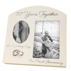 an anniversary photo frame with two wedding rings on it and the words, 25 years together