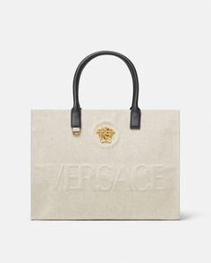 La Medusa Canvas Large Tote Bag Beige | Versace US Luxury Logo Tote Shoulder Bag, Designer Tote Bag With Logo, Beige Top Handle Bag With Embroidered Logo, Luxury Tote Bag With Embroidered Logo, Luxury Double Handle Shoulder Bag With Logo, Luxury Shoulder Bag With Logo And Double Handle, Luxury Shoulder Bag With Double Handle And Logo, Luxury Shoulder Bag With Logo For Daily Use, Luxury Beige Canvas Bag With Handles