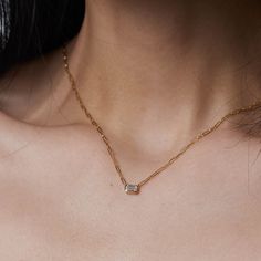 Modern and elegant, this 14k gold diamond necklace features an emerald cut diamond in a bezel setting on a paperclip chain from Gilded by G.St. Able to special order in rose or white gold- please allow 5 weeks for production and delivery. • 14k gold• 0.25ct emerald cut diamond (G-H color, SI clarity)• Chain length: 16-17" All G.St collections are designed and crafted by us in NYC using recycled gold, conflict-free diamonds and responsibly sourced gemstones. Diamond Necklace With Paperclip Chain As Gift, Diamond Necklace With Paperclip Chain For Gift, Classic Diamond Necklace With Paperclip Chain, Formal Diamond Necklace With Paperclip Chain, Emerald Cut Diamond, Gold Diamond Necklace, Emerald Cut Diamonds, Diamond Pendant Necklace, Recycled Gold