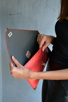 Red Metallic Symmetria Clutch. The perfect bag for all occasions! Ideal for cocktail and parties, weddings and more. This adorable clutch is handmade out of a genuine, lux Italian red metallic cow leather. It fits all your essentials, wallet, keys, mobile, cosmetics etc. It is hand stitched with red waxed thread. The interior is fully lined with dark gray leatherette. I use leatherette for the interior because it can easily be cleaned with a slightly damp sponge. The clutch closes with a metal t Red Pouch Clutch For Party, Designer Red Evening Bag For Party, Red Pouch Clutch For Evening, Designer Leather Clutch For Party, Red Leather Evening Bag For Party, Leather Envelope Clutch For Evening, Envelope Leather Clutch For Evening, Red Clutch Evening Bag As Gift, Red Leather Evening Bag