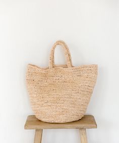 Woven Raffia Tote Natural OS Summer Straw Bucket Bag With Rolled Handles, Large Straw Beach Bag For Summer, Summer Crochet Bag With Rolled Handles For Vacation, Summer Travel Crochet Bag With Rolled Handles, Summer Vacation Crochet Bag With Rolled Handles, Travel Bucket Bag With Rolled Handles, Beige Beach Bag With Round Handle For Travel, Top Handle Beach Bag In Natural Fiber For Travel, Natural Fiber Top Handle Beach Bag For Travel