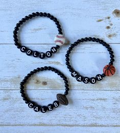 Perfect gift for your little sports fan! This listing is for one (1) bracelet.  Beads are matte black and are 4mm. Bracelet sizing chart is just a general guide.  Since wrist size varies greatly from person to person, please measure your wrist and add half (.5) an inch to get the best fit. ✨Jewelry Care✨ 💜 Avoid contact with water, perfumes, lotions and chemicals 💙 Roll bracelet on and off wrist to avoid overstretching. 💛 Do not drop your bracelets on hard surfaces. 💚 Store in a cool, dry pl Soccer Bracelet For Boys, Cheap Adjustable Bracelets For Football Season, Sports Bracelets Diy, Bead Bracelets For Boys, Baseball Bracelet Diy, Beaded Bracelets For Boys, Bracelet Ideas For Boys, Bracelets Boys, Kid Bracelets