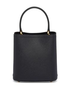 Find PRADA Small Panier Leather Tote Bag on Editorialist. This Prada tote bag features a leather construction with a triangle logo, leather tag, gold-tone hardware, a single top handle, a detachable shoulder strap, a magnetic fastening, a partitioned compartment, an internal logo stamp, and metal feet. It is a small tote bag. High-end Satchel With Bucket Shape And Detachable Handle, High-end Bucket Satchel With Detachable Handle, High-end Double Handle Bucket Bag, Designer Bucket Bag With Gold-tone Hardware, Designer Bucket Bag Satchel With Gold-tone Hardware, Luxury Bucket Bag With Gold-tone Hardware Satchel, High-end Daily Use Bucket Bag With Gold-tone Hardware, Designer Top Handle Bucket Bag For Evening, Designer Bucket Bag With Top Handle For Evening