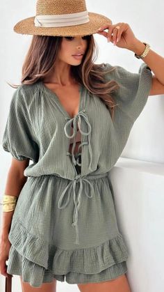 This cotton playsuit is a must-have for any wardrobe! Made from 100% cotton for ultimate comfort, it features a one-size-fits-all design that will flatter any figure. Perfect for any occasion, whether you're lounging at home or out for a day of adventure. Upgrade your style game with this versatile and trendy piece! Summer Loungewear Jumpsuits And Rompers In Solid Color, Summer Style Solid Jumpsuits For Loungewear, Summer Solid Color Tops With Tie Waist, Solid Color Summer Top With Tie Waist, Solid Summer Top With Tie Waist, Summer Solid Top With Tie Waist, Beach Top With Drawstring, Summer Cotton Jumpsuits And Rompers For Vacation, Green Cotton V-neck Jumpsuits And Rompers