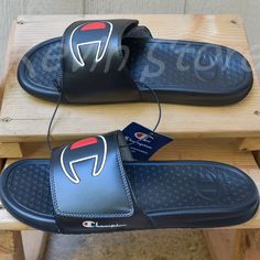 Champion Unisex Slide-Black Brand New . Embossed "C" Logo Adjustable Hook And Loop Closure Open Toe Lightweight Slide Sandal Made In China Contents: 100% Pu Black Slides With Cushioned Footbed For Training, Black Slides For Training In Summer, Black Slides For Summer Training, Black Casual Slides For Training, Casual Black Slides For Training, Mens Slides Sandals, Champion Slides, Mens Slide Sandals, Champion Shoes