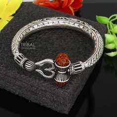 Amazing handcrafted chitai or kandrai work 925 sterling silver vintage design custom-made oxidized silver personalized unisex gifting jewelry from india. Metal-925 sterling silver. Item type-/bracelet/ Kada. Weight-52.660 grams. Size-2-8 (2.5 inches inner diameter)We can easily adjust by twisting it for bigger size. Width-0.9 centimetres Stamped- 925. Finish-Oxidized. Makes excellent gifting for birthday, mother's day, father's day, Christmas day,valentinesday, wedding, anniversary gifts Trishul Kada For Men, Antique Silver Oxidized Bracelet For Rituals, Rudraksh Breslet For Man, Luxury Traditional Sterling Silver Bracelet For Men, Rudraksh Bracelet For Men Silver, Shiva Trident, Lord Shiva, Oxidized Silver, Shiva