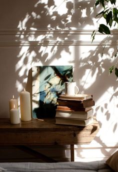 a stack of books sitting on top of a wooden table