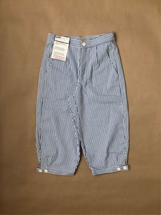 Unworn, originating from the archive of a jeans shop that closed down late last century.  Unworn Lee pirate shorts in white and blue stripes, a prototype made in 1981 according to the tag. High rise and tapered leg with two plastic buttons on each knee to adjust the fit. Talon 42 zipper, plastic button in the waist. 100% cotton, made in Belgium, sized M  Waist: 76cm / 30" Front rise: 29cm / 11.5" Seat: 101cm / 40" Inseam: 45cm / 18" For information about our full terms & conditions please review Pirate Shorts, Skorts, Jeans Shop, Short Outfits, Blue Stripes, Favorite Outfit, Vintage Ladies, High Waist, High Rise