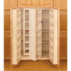 an open cabinet with several shelves in it