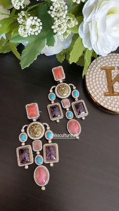 "Hot Selling Sabyasachi Inspired Long earrings with multicolor doublet stones in prong & bezel setting with cubic zirconia all around. Victorian finish designer statement earrings. You get what you see. Picture is of original piece. 💥Super Trendy 💥Statement Earrings 💥Size: 4\"  💥Earrings Closure: push back and clip back screws for comfortable fit.  ✅Check other styles available in our store  https://www.etsy.com/shop/KKsCulture  WHAT GOES IN  👉🏻High Quality Raw materials and finishing guarantee. We want you to LOVE your new jewelry!  CARE TIP  1. Keep away from moisture and perfume 2. Store in cotton or zip lock bags or air tight boxes. 3. Spot cleaning only. 4. Jewellery is the last thing you should wear and the first thing you should remove. 👉🏻Send us an email if you need help! ✅ 4 Earrings, Lion Earrings, Sabyasachi Jewellery, Cocktail Earrings, Earrings Indian, Pakistani Jewelry, Wedding Jewelry Earrings, Ear Rings, Fit Check