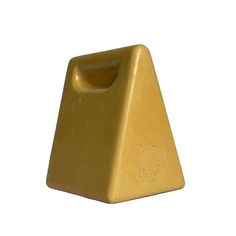 a gold triangle shaped object on a white background