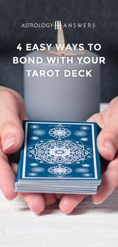 a person holding a card in their hands with the text 4 easy ways to bond with your tarot deck