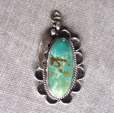 Gorgeous early 80s vintage Navajo turquoise and sterling silver pendant with deep, carved scalloped edges is accented with rope and traditional feather trim. This stone with its strong coloration of blue, green and deep rust also has bits of robin's egg blue. It was likely mined in Nevada's famous Royston mining region. This pendant was my mother's, and she bought it for the beautiful, unusual stone and deeply carved setting. It has been treasured, but rarely worn and carefully stored. It's unus Robin's Egg Blue, Feather Trim, Native American Turquoise, Navajo Turquoise, Royston Turquoise, Robins Egg Blue, Vintage Navajo, 80s Vintage, Scalloped Edges