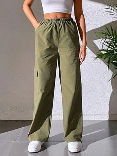 Stay effortlessly stylish with our Casual Plain Cargo Cropped Pant. These pants feature a cropped length and a clean, plain design, offering a versatile and contemporary style. With a relaxed fit and comfortable fabric, they are perfect for casual and everyday wear. These cargo cropped pants are a must-have addition to your wardrobe for a trendy and laid-back look.Specification: Style: Casual Pattern Type: Plain Type: Cargo Pants Closure Type: Elastic Waist Details: Pocket Waist Line: Natural Le Casual Plain Workwear Pants, Casual Plain Pants For Work, Cotton Solid Color Straight Cargo Pants, Cotton Straight Cargo Pants In Solid Color, Casual Solid Color Parachute Pants For Outdoor, Wide Leg Cotton Cargo Pants, Casual Straight Leg Parachute Pants For Spring, Wide Leg Cotton Cargo Pants In Solid Color, Spring Casual Straight Leg Parachute Pants