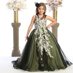 This beautiful dress is made to impress.  with lovely embroidered detail work.  The light champagne color leaves embellish the dress with a subtle elegance making it able to wear any time of the year.   The falling leaves are reminiscent of  Autumn and spring.   This dress is best for an event where the little girls will  be the center of attention.  The buttoned back closure are actual fabric covered buttons, the individually go in to each individual eyelet.  To ensure a proper fit for your girl, please send me over the little girls measurements so we can find the best fit for her.   Since not all girls are the same size even when they are the same age we strongly suggest sending in your measurements.  We are not responsible for a dress not fitting if we never received any measurements. Fitted Green Gown With Floral Applique, Formal Ball Gown With Floral Applique, Elegant Green Dress With Floral Applique, Green Floral Applique Wedding Gown, Green Wedding Gown With Floral Applique, Elegant Ball Gown With Floral Applique, Elegant Sleeveless Green Princess Dress, Elegant Sleeveless Ball Gown With Floral Applique, Elegant Fitted Ball Gown With Floral Applique