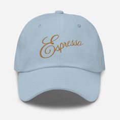 a light blue cap with the word espressa printed on it and gold lettering