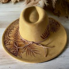 Burned Wide Brim hat using Pyrography techniques. Freehand Art making this a one of a kind. Hat is adjustable. Hat is sprayed for weather protection. Hat comes with Signature PIPER Tote/Dust Bag and macrame wall hanger. Pyrography Techniques, Macrame Wall Hanger, Velvet Hat, Art Making, Wide Brimmed Hats, Brim Hat, Pyrography, Macrame Wall, Adjustable Hat