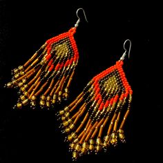 Mexican Artisanal Dangling Beaded Earrings New Without Tags Bohemian Orange Fringe Earrings, Traditional Beaded Earrings With Fringe And Round Beads, Traditional Fringe Beaded Earrings With Round Beads, Traditional Fringed Beaded Earrings, Artisan Orange Beaded Earrings, Artisan Orange Round Bead Earrings, Orange Beaded Dangle Jewelry, Traditional Beaded Tassel Earrings, Traditional Beaded Fringe Chandelier Earrings