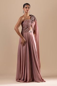 Blush one shoulder padded draped saree gown with crystal, cutdana, sequin embroidery in floral pattern. - Aza Fashions Draped Saree Gown, Saree Gowns, Draped Saree, Saree Gown, Drape Saree, Sequin Embroidery, Sequins Embroidery, Pink Sequin, Aza Fashion