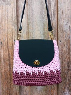 This handmade crochet bag is my creative work, lovingly crafted by hand. It is a perfect choice for those who love urban style, color, and minimalism. The small pink purse is made from high-quality polyester cord and features faux leather details, including the bottom, flap, and top handle. The harmonious combination of rose, burgundy, and black colors makes this compact handbag a versatile accessory that will complement any outfit. This handbag is compact, lightweight, yet sturdy. It's the perf Pink Crochet Satchel Bag With Adjustable Strap, Pink Satchel Crochet Bag With Adjustable Strap, Handmade Pink Crochet Shoulder Bag, Pink Crochet Crossbody Bag For Everyday, Pink Crochet Crossbody Bag For Daily Use, Pink Crochet Bag With Adjustable Strap For Everyday Use, Handmade Square Pink Crochet Bag, Pink Crossbody Crochet Bag For Daily Use, Pink Crossbody Crochet Bag For Everyday Use