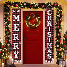 a red door decorated with christmas lights and wreaths, surrounded by holiday decorations that spell merry