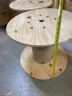 two plywood tables with measuring tape on the top one is made out of plywood