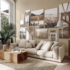 a living room filled with lots of pictures on the wall and furniture in front of it