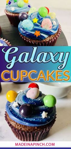 two cupcakes with galaxy decorations on top and the words galaxy cupcakes above them