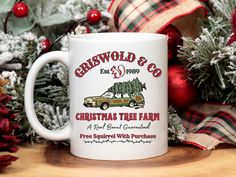 a christmas tree farm coffee mug sitting on a table