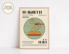 a poster advertising spaghetti in italian cuisine on a white wall next to a wooden frame