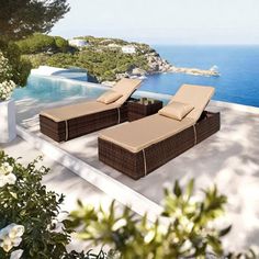 two chaise lounge chairs sitting on top of a patio