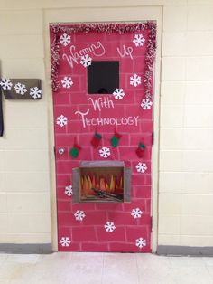 a red door decorated with white snowflakes and christmas decorations that reads, merry us with technology