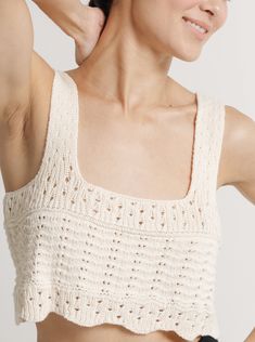 The estimated shipping window on all resort pre-orders is 1/15/24 - 2/1/24. We are pleased to introduce the newest technique to our apparel collection - crochet. The Lyric Top is a breezy, timeless tank with stunning handwork that evokes an effortless sense of luxury. Pair it with the Roma Top for a layered look or simply with your favorite short for a chic, seasonal ensemble. Made with 100% Cotton Handmade in Peru Hand wash, lay flat to dry Honoring Earth + Maker Our knitwear is handcrafted in Textured Knit Crochet Top For Summer, Sleeveless Textured Knit Top For Vacation, Chic Summer Crochet Top With Knit Fabrication, Chic Crochet Top With Knit Fabrication For Summer, Chic Summer Crochet Knit Top, Chic Crochet Top For Summer, Summer Cropped Pointelle Knit Top, Summer Textured Knit Crochet Top, White Pointelle Knit Tank Top For Summer