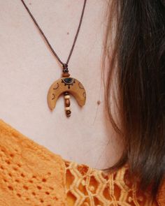 A handmade halfmoon necklace. The pendant is made of local birch wood. A piece of nature for you. Each piece of wood is unique. Therefore, the shape of your delivered necklace may differ slightly from the product images.  After sawing the tree slices, the wood is finely sanded and drilled. I burn the design into the wood by hand and treat it with a natural oil mixture. The oil protects the pendant from external influences and keeps it looking beautiful for a long time. Still, you should take off Wood Pendant Necklace, Wooden Necklace Handmade, Wood Necklace Pendant, Necklace With Beads, Necklace Wood, Wooden Bead Necklaces, Tree Slices, Wood Burning Crafts, Wooden Necklace