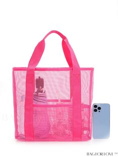 a pink tote bag next to a cell phone on a white background with the back side open