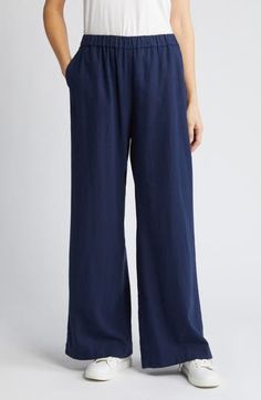 Cut from a breezy linen blend with a high waist and wide legs, these pull-on pants are a cool remake of a closet classic. 30" regular inseam; 25" leg opening; 11 12" front rise; 16" back rise (size Medium) 28" petite inseam; 24" leg opening; 11" front rise; 15" back rise (size Medium P) Elastic waist Front slant pockets; faux back welt pocket 55% linen, 45% rayon Machine wash, tumble dry Imported Women's Clothing Linen Blend Pants, Denim Maxi Skirt, Navy Blazer, Wide Legs, Pull On Pants, Jean Paul Gaultier, Wide Leg Jeans, Welt Pocket, Bottoms Pants