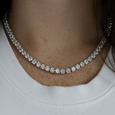 Beautiful, High Quality Tennis Chain Necklace Featuring Round Cubic Zirconia Stones. A Sophisticated Necklace To Add Glam To Your Look! Available In Silver Or Gold 18k White Gold Or Gold Plating Over Metal Alloy Highest Quality Cubic Zirconia Stones Available Lengths: 16", 18" Available Thicknesses/Widths: 3mm, 4mm, Or 5mm This Item Is Plated To Resist Against Tarnishing. Over Time, Plated Jewelry May Tarnish And To Prevent This, We Recommend Avoiding Exposure To Water, Sweat, Etc To Ensure The Tennis Necklace Diamond Gown, Elegant Luxury Tennis Necklace With Brilliant Cut, Silver Tennis Chain Necklace, Tennis Silver Necklace, Luxury Lab-grown Diamond Tennis Necklace With Brilliant Cut, Diamond Necklace Sparkle, Diamond Necklace On Chain, Cubic Diamond Necklace, Hot Diamonds Necklace