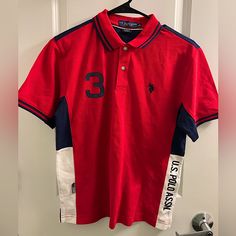 This Item Is New. Never Worn W/O Tags . No Stains. No Tears. In Excelente Conditions. I Ship Orders Within 1-2 Of Sale Date. Check Out My Other Items I Listed. I Post Newitems Every Day. Thank You Kindly And Hope You Are Having A Great Day! Red Collared Sports Top, Red Polo Shirt With Graphic Print, Red Collared Polo Shirt With Graphic Print, Red Sporty Polo Collar Top, Sporty Red Polo Collar Top, Sporty Red Top With Polo Collar, Sporty Red Short Sleeve Polo Shirt, Red Collared Sporty Shirt, Red Cotton Polo Shirt With Graphic Print