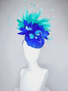 From the 2024 Featured Milliner of the Kentucky Derby Museum  Gorgeous Kentucky Derby hat fascinator  kentucky derby hat fascinator royal blue satin with green feathers and blue green feather flowers  headband attachment.  each hat is totally one of a kind! no two are alike! I can probably add feathers, flowers etc to existing hats for a small fee. I cannot remove anything from existing hats. Just message me and see if we can make it work! :) I cannot make custom order from scratch. My schedule Blue Fascinator For Kentucky Derby Races, Blue Feathered Hat For Races, Blue Feathered Summer Costume Hats And Headpieces, Blue Feather Trim Headpiece For Kentucky Derby, Blue Feather Headpiece For Kentucky Derby, Blue Feather Trim Mini Hat For Kentucky Derby, Blue Fascinator For Royal Ascot, Blue Feather Fascinator For Summer, Blue Feathered Fascinator For Summer