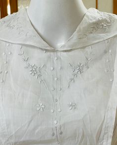 "This period piece white cotton ladies dress is just amazing -- it dates from 1800s or early 1900s -- and in amazing condition.  It's so beautiful and so feminine like many period piece ladies clothes. A different era indeed!  Despite being an Edwardian / Victorian / Regency eras garment, it's still a very wearable design style today. Classic!  The dress closes in the front with hook & eye closures.  The bodice and collar have exquisite white on white floral embroidery.  The long skirt has three panel borders of lace. The skirt isn't poofy but has volume so the wearer can comfortably walk and move in it.  For a historical garment, this is still quite a wearable piece. It's somewhat sheer so please consider underthings when calculating fit on you.  It would also be lovely as a home / shop d White Elegant Victorian Dress With Broderie Anglaise, White Regency Style Vintage Dress For Formal Occasions, Elegant White Cotton Victorian Dress, Vintage White Victorian Dress With Broderie Anglaise, White Vintage Victorian Dress For Spring, Vintage Cotton Dress With Historical Design, White Cotton Victorian Dress For Wedding, Classic Victorian Dress For Vintage Events, White Cotton Victorian Wedding Dress