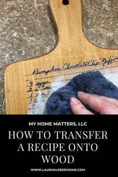 a person using a rag to clean a wooden cutting board with text overlay that reads, my home matters, how to transfer a recipe onto wood