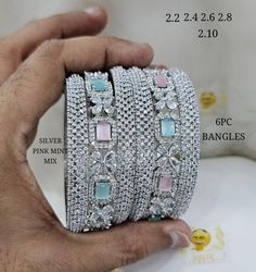 Silver American Diamond Bangle/Bracelet Indian Jewelry/Silver Finish Bridal Bracelet/ Wedding Bangle/ Cubic Zirconia Bangles/Pack of 6 Pcs Making Time 10-15 Days Size Available  2.6 In Personal trust me this is so much beautiful and in great quality nath, video call also available too see our products. Fashion Empire Studio gives you new look, Made of high quality material(s).  This is very Designer, Tradition Kada . Every Women wants Wear Something new and Stylish Items so this is only for u. Its A Choice Of Many Bollywood Celebrities. Trust me, it is more Beautiful in Real another the Picture  Designed By Master Craftsmen. Based On Indian beautiful Jewelry with a touch of the a contemporary art. Close Up Pictures Taken To Show Details In Item, So Item May Looks Larger. Please Read Above Silver Bracelet With Cubic Zirconia Stones, Silver Bangle Bracelet With Sparkling Stones, Silver Bracelets With Stones For Party, Silver Bracelet With Stones For Party, Silver Party Bracelet With Stones, Dazzling Silver Hand Set Bracelets, Silver Cubic Zirconia Bangle Bracelet, Dazzling Silver Bracelets With Stone Setting, Dazzling Silver Bracelet With Stone Setting