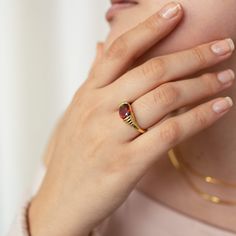 Our vintage-inspired Garnet Signet Ring adds a pop of color into your wardrobe, in a stunning yet timeless way. A beautiful emblem of individuality, this design can become your signature, staple piece. • Material: High-Quality Solid 925 Sterling Silver • Finish: 18K Gold • Featuring 8mm x 10mm CZ Garnet Gemstone SKU: RR-RR014 Fingerprint Ring, Gold Gemstone Ring, Garnet Jewelry, 18k Gold Ring, Zircon Ring, Valentines Jewelry, Garnet Rings, Garnet Gemstone, Pinky Ring