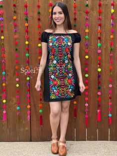 This Beautiful Dress boasts a Traditional Mexican floral design and is the perfect dress to add to your wardrobe. The Off the Shoulder design combined with the bold and colorful embroidery adds style to your wardrobe. This dress is handmade and embroidered on Artisanal Machine by Mexican Artisans in Puebla, Mexico. Purchase the Shoes modeled here: https://www.etsy.com/es/listing/830412617/tacon-artesanal-de-bloque-zapato?ref=listings_manager_grid Black Folk Style Summer Dress, Black Folk Embroidered Summer Dress, Black Floral Embroidered Summer Dress, Black Embroidered Dress For Spring, Black Fitted Embroidered Dress For Festival, Embroidered Black Summer Dress, Black Cotton Folk Embroidered Dress, Fitted Dresses With Geometric Embroidery For Festival, Traditional Black Spring Dresses