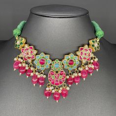 Jadau kundan /choker with earrings in brass to make your occasion dazzle!   Handcrafted  Ethnic Kundan Necklace and matching Earrings Set. * It's made from Brass n Copper Pink, green and White Multi color Kundan Stones Settings with 22 ct gold Plating on Jadau motifs.  Occasion to wear: Party, wedding, marriage, kitty parties and any special occasion. *Handcrafted with care by happy hands and full hearts by world class artisans across India. Jadau Necklace, Kundan Choker Set, Copper And Pink, Pink Emerald, Kundan Choker, Kundan Necklace, Choker Set, Kundan Necklaces, Cat Party