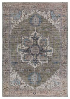 an antique rug with blue, green and beige colors