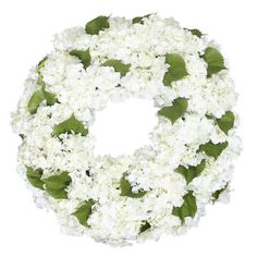 a wreath with white flowers and green leaves